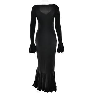Detail of elegant black long sleeve fishtail dress with a sexy backless design