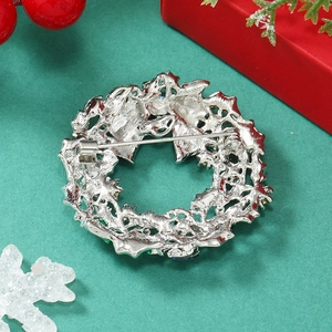 Detailed back view of silver Christmas wreath brooch featuring a secure pin clasp closure