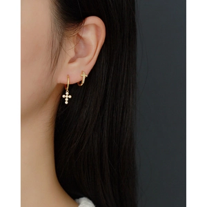S925 sterling silver gold-plated cross hoop earring and stud set on female model