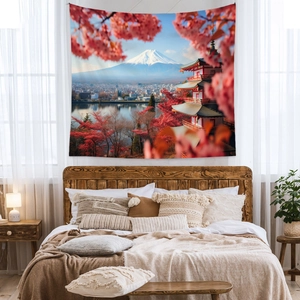 Detail of Mount Fuji tapestry featuring cherry blossoms and pagoda in a bedroom setting
