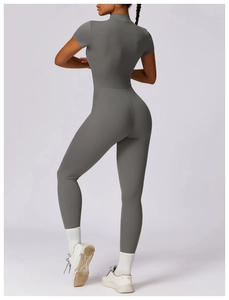 Close-up back view of dark grey short sleeve yoga jumpsuit showing fabric texture and fit