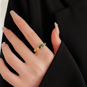 Detail of adjustable dragon phoenix ring with gold finish and gradient enamel inlay
