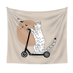 Detail of minimalist wall tapestry showing a cat on a scooter with orange sun on white wall