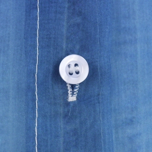 Blue denim print organza shirt with detailed white button and visible fabric texture