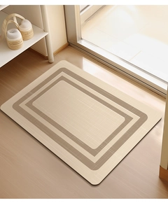 Detail of diatom mud bath mat with geometric patterns on a wooden floor in natural light