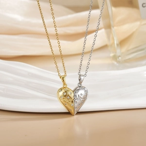 Close-up of magnetic heart necklaces with wavy textures and micro-paved zircons