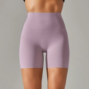 Close-up of high-waisted lilac yoga shorts featuring double-sided brushed elastic fabric