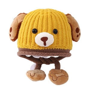 Winter knit child hat with puppy ears and earflaps for warmth in yellow and brown