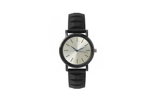 Detail of minimalist black quartz watch featuring a textured silicone strap and silver sunray dial
