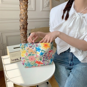 Close-up of floral makeup bag showing vibrant flower patterns and durable fabric texture