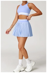 Detail of light blue tennis sports set with ribbed textures and white striped waistband