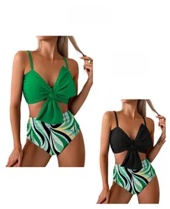 Detail of high waisted bikini set featuring front bow knot top and geometric print bottoms