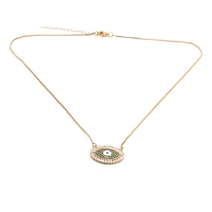 Detail of gold-plated evil eye necklace featuring vibrant green and blue zircon stones