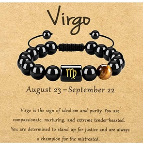 Detailed view of Virgo zodiac bracelet with black beads and Tiger Eye stone on card