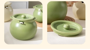Detailed view of the green ceramic lard jar with lid and spoon opening for home kitchen
