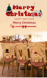 Detail von Weihnachts-Stuhlbezügen mit bestickten Schneemann-, Rentier- und Weihnachtsmann-Motiven