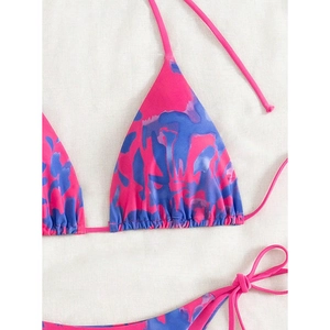 Detail of pink and blue tie-dye bikini top with halter neck and string ties