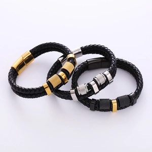 Detail of multi-layered braided leather bracelets with textured metal clasps in three colors