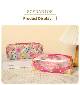 Macro detail of transparent PVC waterproof cosmetic bags with watermelon and heart prints