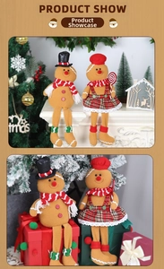 Detail of plush gingerbread man couple dolls with festive hats and plaid skirt