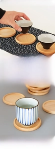 Detailed view of hand-polished beech wood coaster with natural grain for tea cups