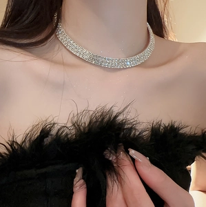 Close-up of sparkling silver rhinestone choker necklace with multi-row crystal detailing