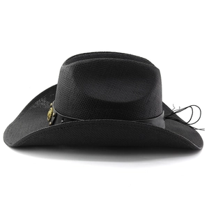 Detail of woven straw texture and leather band with vintage gold metal buckle on a cowboy hat