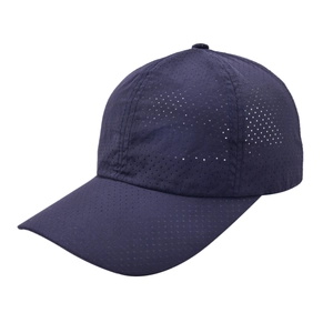 Detail of navy blue quick-dry sports cap showing breathable laser-cut perforation texture