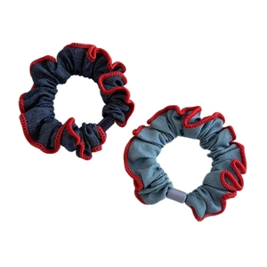 Denim style fabric scrunchies in blue and light blue with red wavy edge stitching