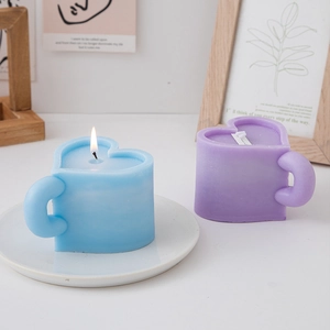 Blue and purple heart-shaped scented candles in macaron color cups with round handles