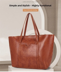Detail of a brown vintage oil wax leather tote bag with large capacity and fine texture