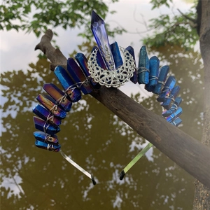 Macro detail of natural blue crystal crown with silver moon ornament on a metal headband