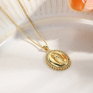 Golden Virgin Mary necklace with shimmering zircon stones in a vintage oval pendant