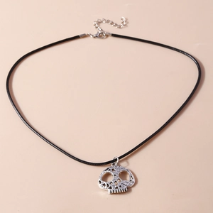 Close-up of silver hollow skull pendant with black leather cord and lobster clasp