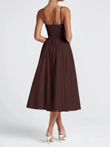 Detail view of dark brown midi dress with elegant lace-up back design and A-line silhouette