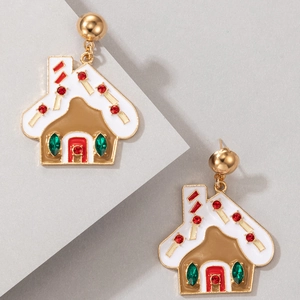 Detail of gingerbread house earrings with white enamel roof and festive red green crystals