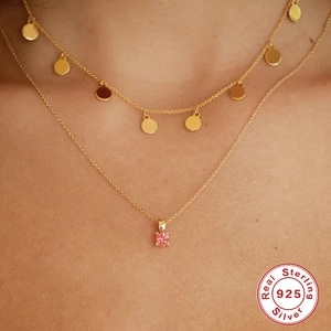 Double-layered 925 sterling silver necklace in gold with pink gemstone and small round charms