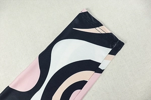 Detail of pink and black abstract zebra print fabric with high-quality double stitching