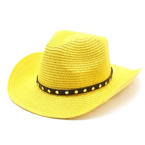 Detailed view of yellow woven straw hat featuring black leather band and silver metal studs