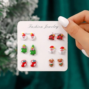 Set of 6 pairs of Christmas resin stud earrings featuring Santa, snowman, and reindeer