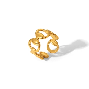 Macro shot of gold-plated horsebit chain link ring with adjustable open band detail
