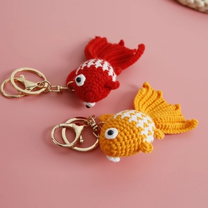 Handmade crochet goldfish keychains in red and yellow with gold-tone metal rings