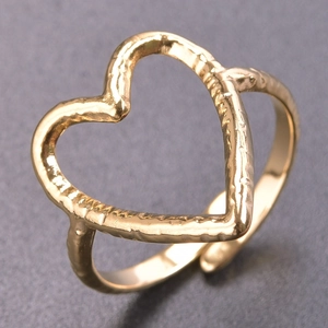 Detailed close-up of a gold-colored open heart ring with unique hammered texture finish