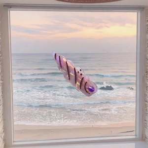 Iridescent purple ocean series hair clip with shell texture against sunset beach background