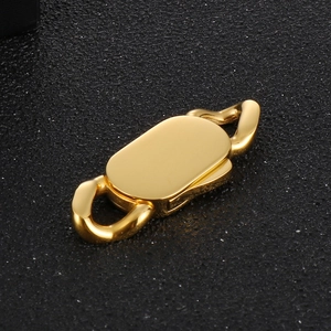 Detailed macro view of gold-plated oval snap clasp for stainless steel jewelry making