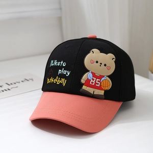 Detail of kids baseball cap featuring 3D cartoon bear patch and basketball embroidery