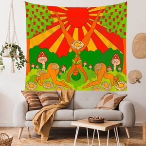 Detail of bohemian tapestry featuring psychedelic sun, mushrooms, and colorful forest art