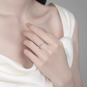 Minimalist S925 sterling silver band ring with pavé moissanite stones on finger
