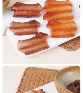 Detailed macro view of realistic faux pork belly keychain with glossy meat textures