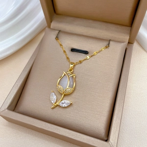 Elegant gold tulip pendant necklace with cat-eye stone and zircons in jewelry box